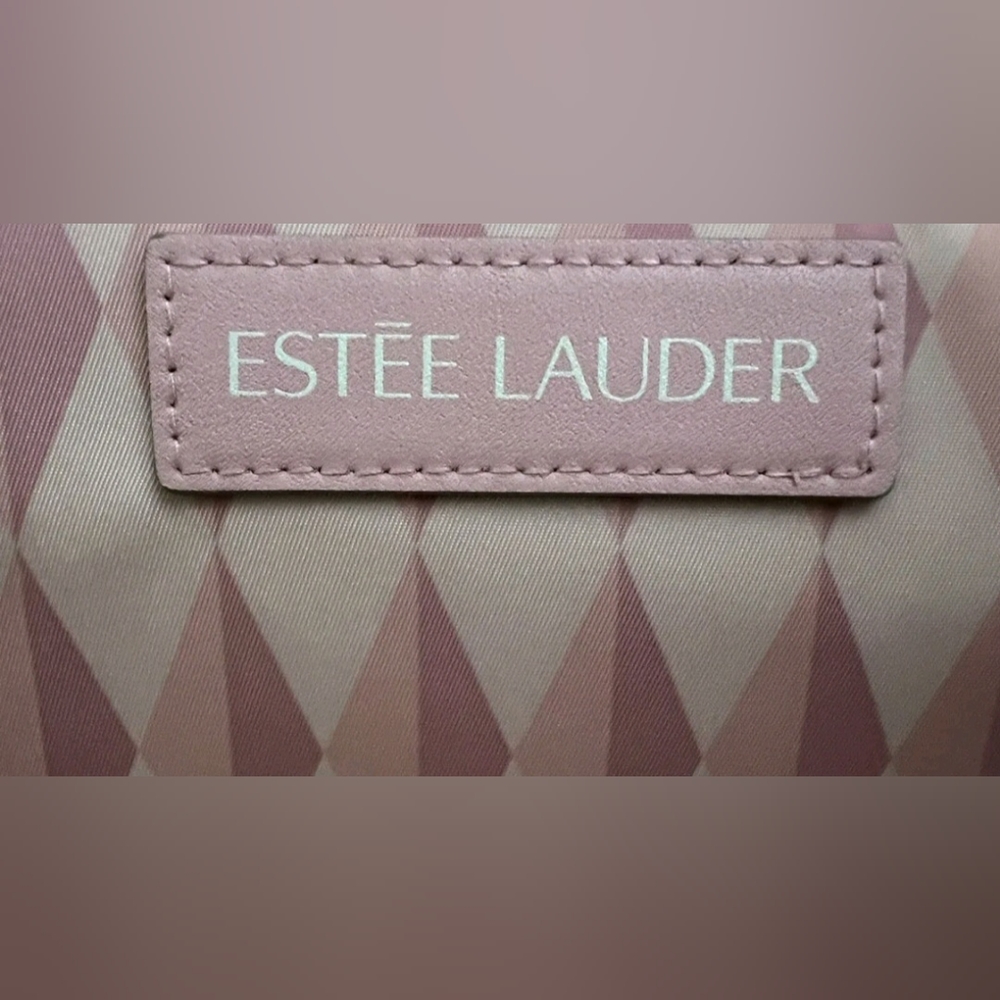 NEW without the tag. ESTEE LAUDER  Cosmetic Makeup bag w/flower pendant.